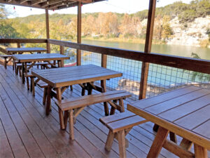 4 ft. Heavy Duty Picnic Tables with two 4 ft Separate Benches are on a deck overlooking a beautiful serene river in the Texas Hill Country. Quality Patio Furniture Handcrafted by Jack Hudson (830) 367-3848